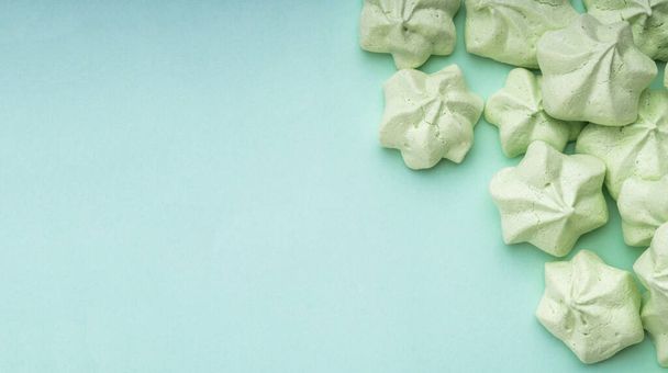 mint green meringues over mint backdrop with copy space - Photo, image
