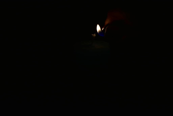 candle and lighter on a black background - Photo, Image
