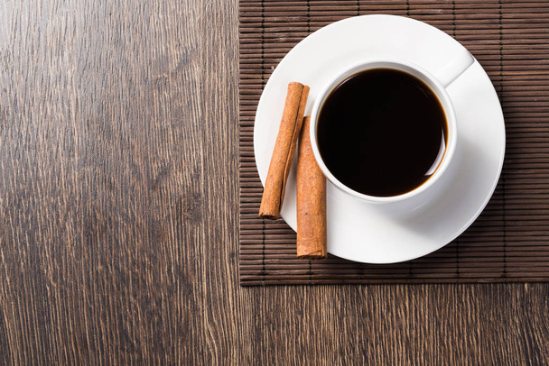 Cup of black coffee on wooden table - Fotó, kép