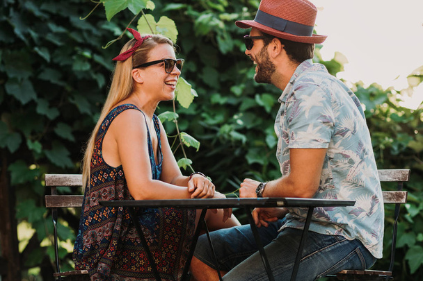 Couple in love enjoying on the beautiful terrace flirting and smiling - Valokuva, kuva