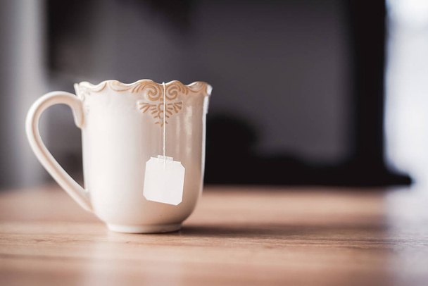 Tea zsák fehér kerámia csésze. - Fotó, kép