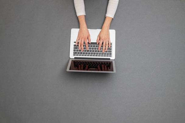 Woman working using a laptop. Overhead image of a business woman - Fotoğraf, Görsel