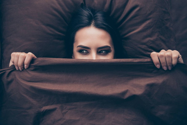 Close-up portrait of her she nice attractive lovely cute cheerful cheery girlish girl covering hiding face dark burgundy maroon veil peeking lying in bed in room flat house indoors - Φωτογραφία, εικόνα