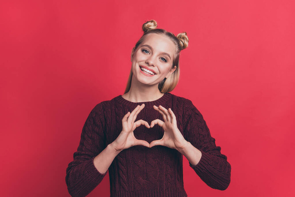 I love you concept. Close up photo portrait of pretty adorable cute dream dreamy girl making showing small hear on her chest wearing maroon color jumper isolated background - Foto, immagini