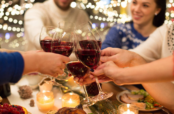 close up of friends with wine celebrate christmas - Fotografie, Obrázek