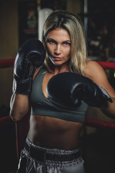 Portrait of experienced female boxer - Фото, зображення