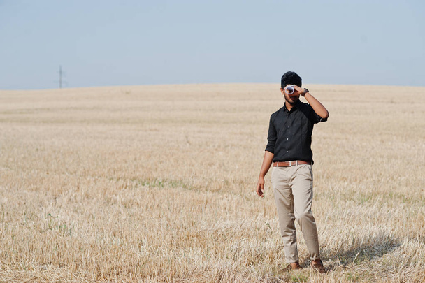 South asian agronomist farmer inspecting wheat field farm. Agric - Foto, afbeelding