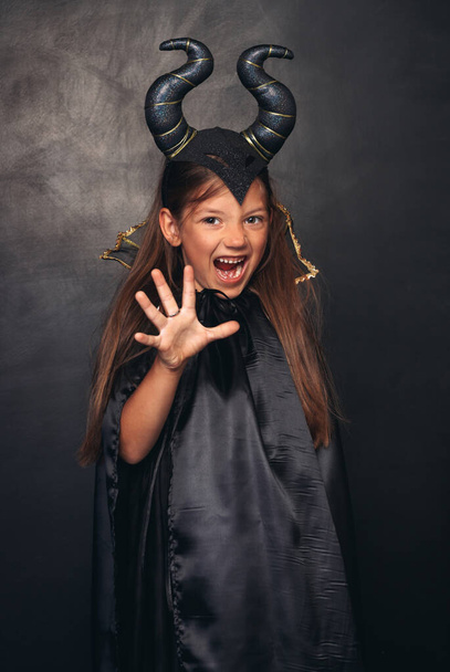 Scary girl in devil costume - 写真・画像