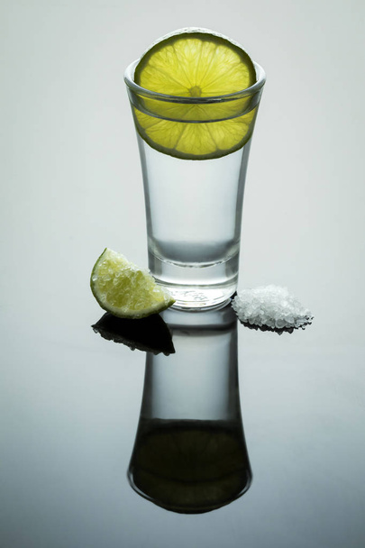 Tequila shot with salt and lemon - Фото, изображение