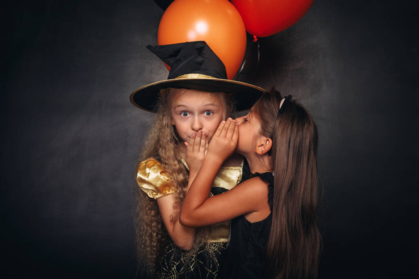 Funny girls with balloons sharing secret - Foto, Imagem