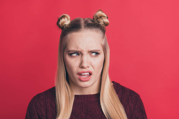 Close up photo of disgusted young blonde woman displeased with result of her work grimacing with depressed facial expression isolated over red vivid color background - Foto, Imagem
