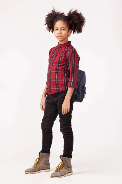 Cute girl in chequered shirt with backpack  - Фото, изображение