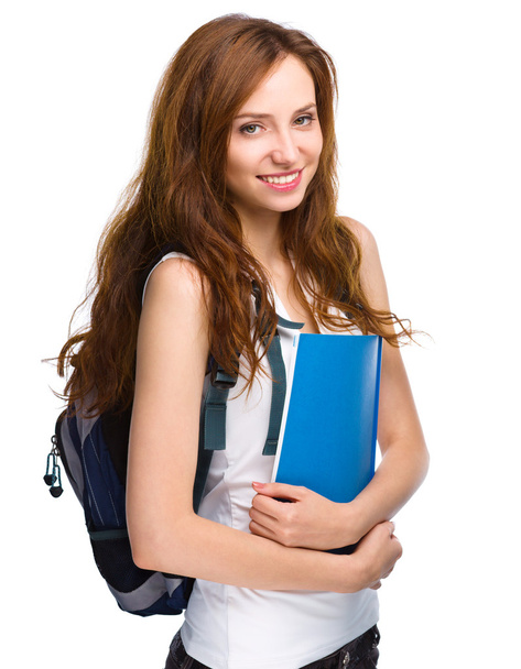 Young student girl is holding book - Photo, Image