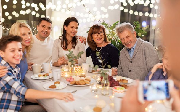 family having dinner party and taking selfie - Photo, Image