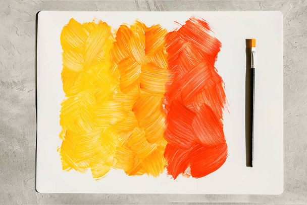 Akciófestmény. Absztrakt kézzel festett sárga és narancssárga művészeti bac - Fotó, kép