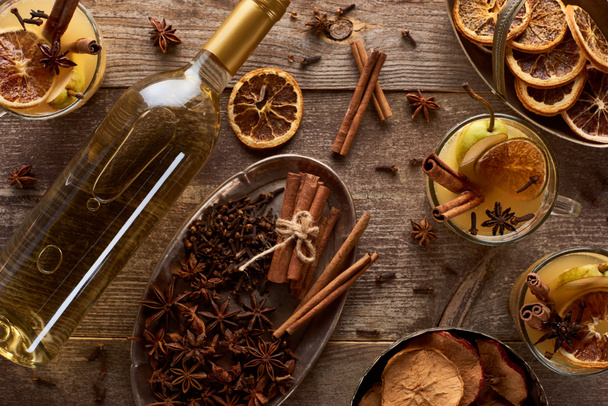 top view of delicious pear mulled wine with spices on wooden rustic table - Foto, imagen