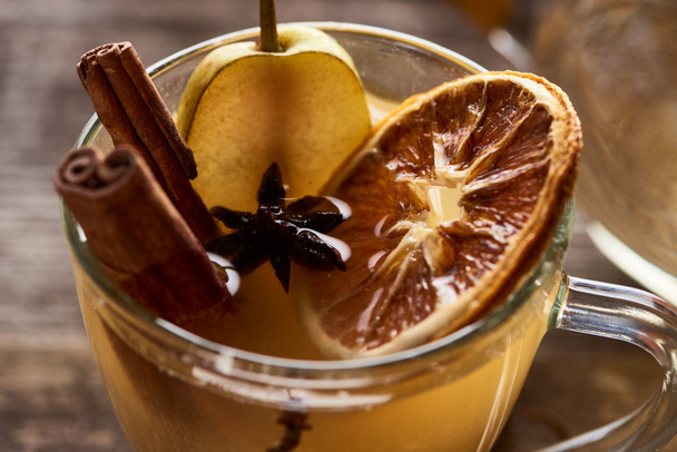 close up view of seasonal traditional pear mulled wine with spices in glass - Photo, Image