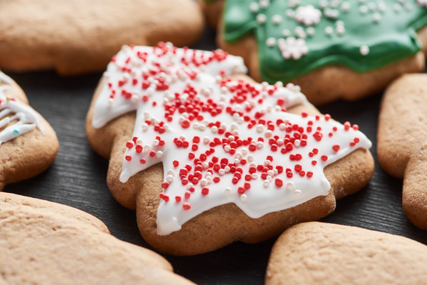 close up view of delicious glazed Christmas tree cookie - Photo, Image