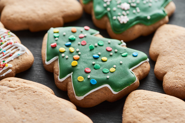 close up view of delicious glazed Christmas tree cookies - Zdjęcie, obraz