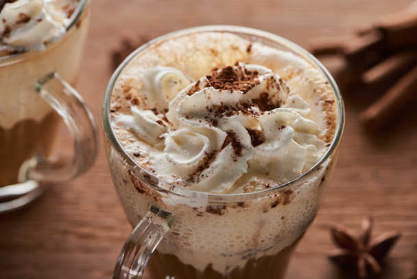 close up view of Christmas cacao with whipped cream on wooden table - Foto, Imagem
