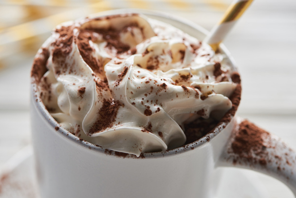 close up view of Christmas cacao with cacao powder and whipped cream in mug with straw - Φωτογραφία, εικόνα
