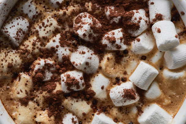 top view of cacao with marshmallow and cacao powder in mug - Foto, Imagen