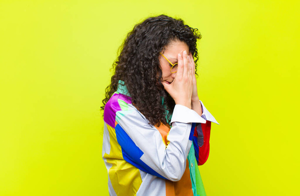 young pretty woman covering eyes with hands with a sad, frustrated look of despair, crying, side view against chroma key wall - Fotografie, Obrázek