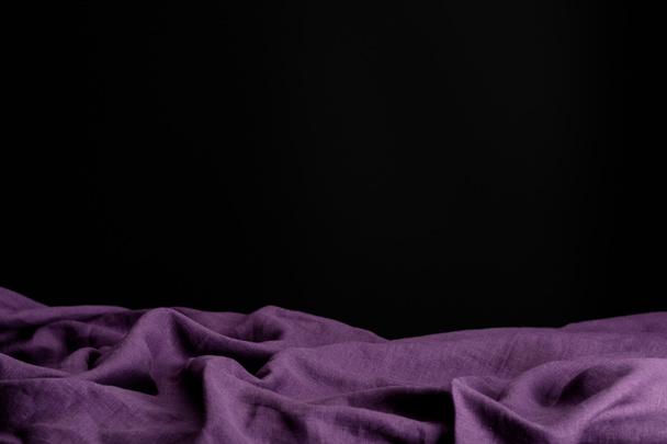 crumpled purple cloth isolated on black with copy space - Φωτογραφία, εικόνα