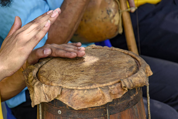Ethnic drums used in religious festival in Lagoa Santa, Minas Gerais near the fire so that the leather stretch and adjust the sound of the instrument - Photo, Image