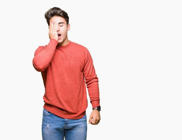 Young handsome man over isolated background Yawning tired covering half face, eye and mouth with hand. Face hurts in pain. - Fotoğraf, Görsel