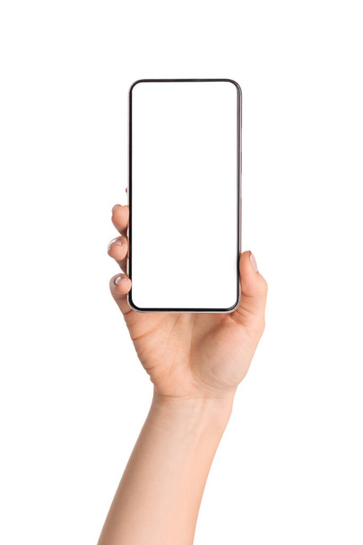Female hand holding smartphone with blank screen over white background - Photo, image