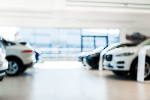 blurred car showroom with new and luxury cars  - Photo, Image