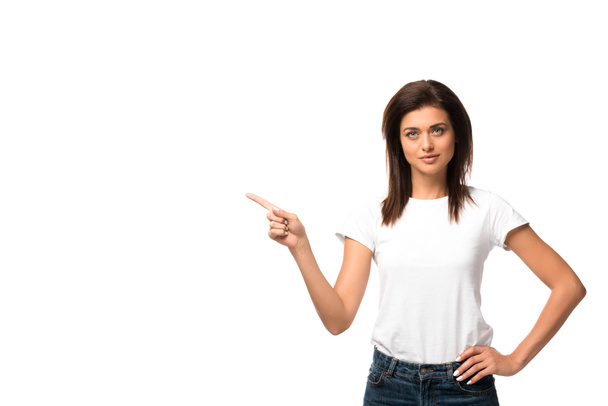 beautiful woman in white t-shirt pointing at something, isolated on white - Foto, afbeelding