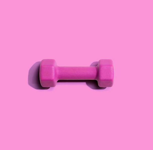 Dumbbell with hard shadow from above - Фото, изображение