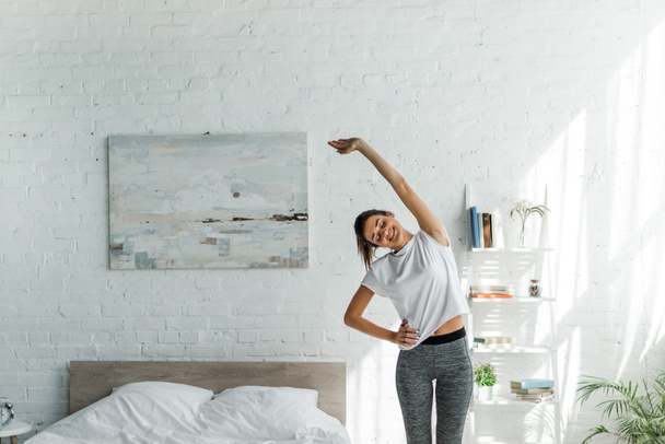 beautiful happiness woman doing morning exercise in bedroom - Fotoğraf, Görsel