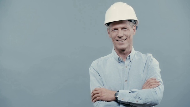 laughing architect in helmet with crossed arms - Footage, Video