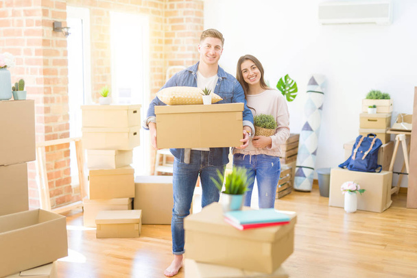 Beautiful young couple moving to a new house  - Photo, Image