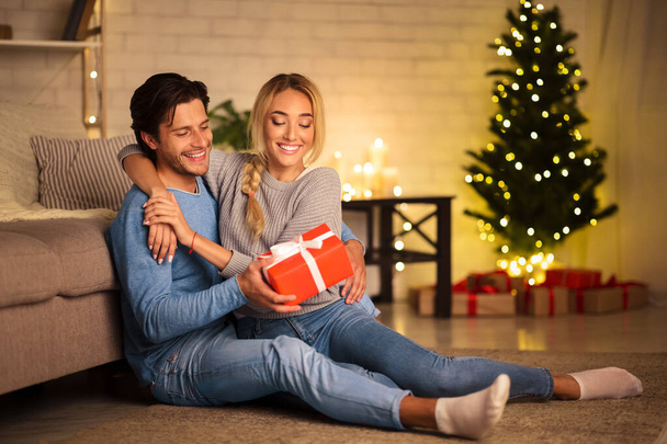 Presents time. Man giving new year present to wife - Photo, Image