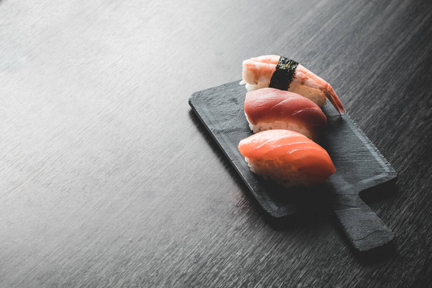 three different nigiris. Salmon, tuna and prawn. Copy space - Photo, image