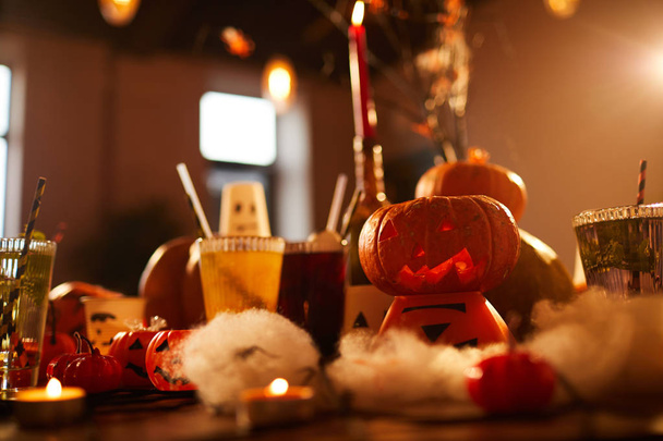 Halloween background of witches table with candles and pumpkins decor set for party in nightclub, copy space - Photo, Image