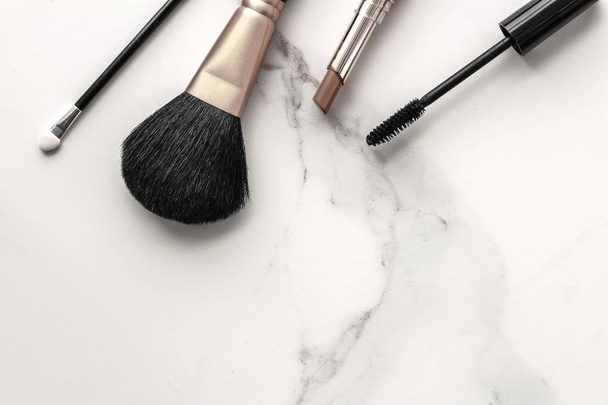 Make-up and cosmetics products on marble, flatlay background - Photo, Image