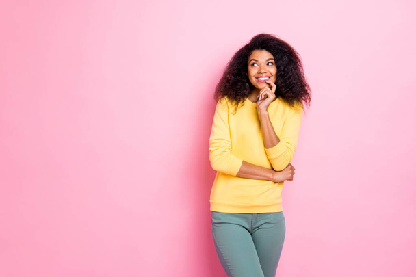Portrait of cheerful positive black girl think have dreams thoughts about her future weekends enjoy her contemplation wear yellow jumper isolated over pink color background - Zdjęcie, obraz