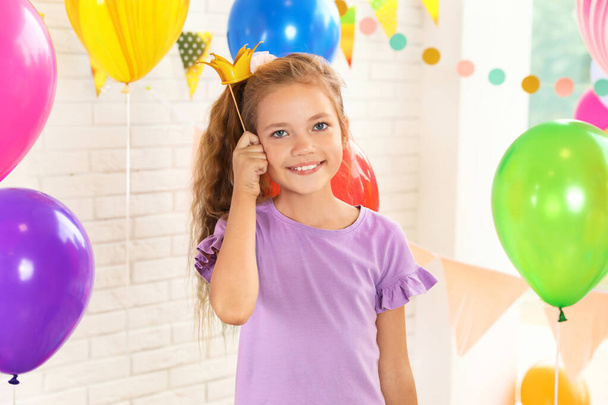 Happy girl near bright balloons at birthday party indoors - Foto, Imagem