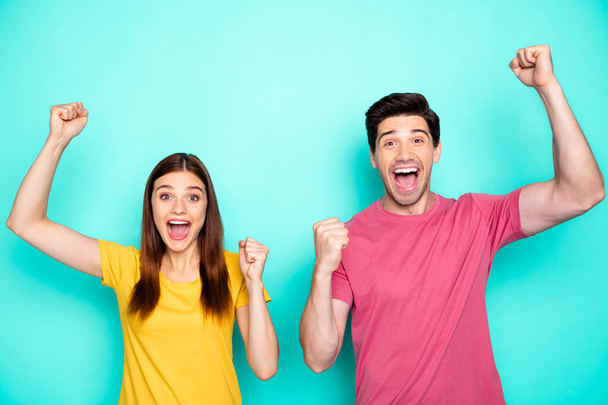 Portrait of his he her she nice attractive glad cheerful cheery couple celebrating crazy spring sale discount good news isolated over bright vivid shine vibrant green blue turquoise background - Foto, Imagen