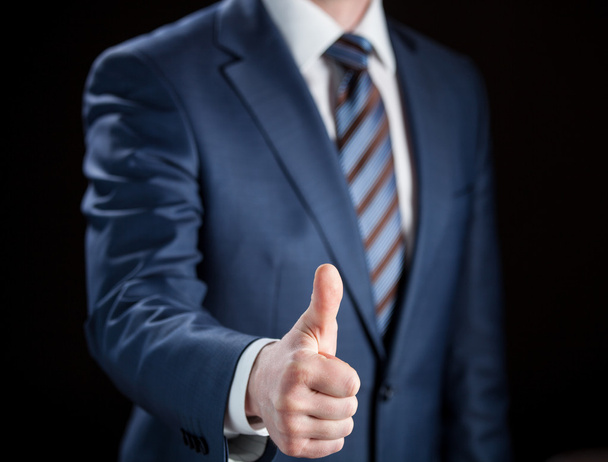Businessman showing thumbs up - Φωτογραφία, εικόνα