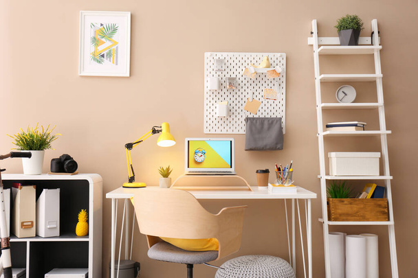 Modern laptop on desk in room. Home workplace - Zdjęcie, obraz