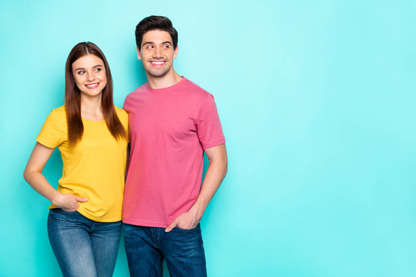 Portrait of his he her she nice attractive lovely charming cute cheerful cheery couple hugging looking aside blank space isolated over bright vivid shine vibrant green turquoise background - Фото, зображення