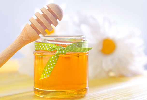 honing in een glazen pot - Foto, afbeelding
