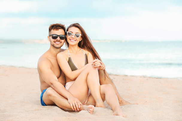 Portrait of happy couple at sea resort - Foto, Imagen