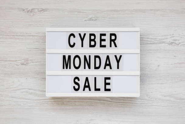 'Cyber monday sale' words on a modern board on a white wooden su - Valokuva, kuva